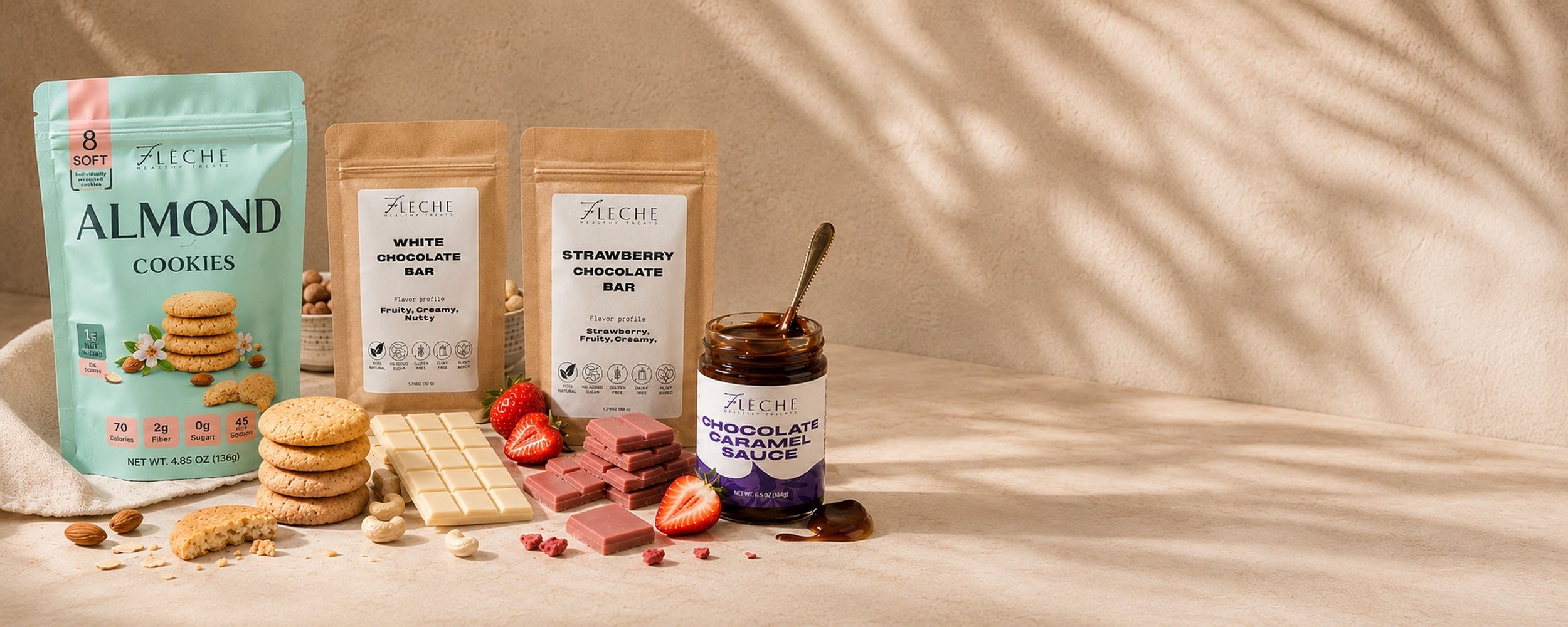Flèche Healthy Treats Assorted products including cookies, bars, and a jar on a neutral background